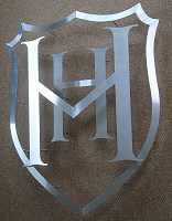 Heathfield School sign. Formed from stainless steel components, shaped and overlapped.