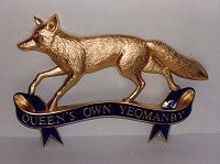 Queen's Own Yeomanry military badge, approximately 36in wide, with gold leaf finish.